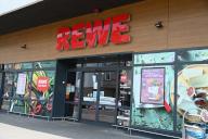 20 May 2024, North Rhine-Westphalia, Cologne: Entrance to a REWE supermarket branch Photo: Horst Galuschka/dpa
