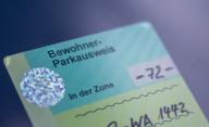 SYMBOL - 27 May 2024, Berlin: A resident parking permit is attached to the windshield of a car in a parking zone in downtown Berlin. Photo: Monika Skolimowska/dpa