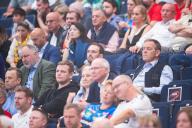 26 May 2024, Hamburg: Handball: EHF European League, Rhein Neckar Löwen - Dinamo Bucharest, Final Four, match for 3rd place, Barclays Arena. Andreas Michelmann (DHB President), Benjamin Chatton (DHB CFO) and Alfred Gislason (national coach) watch the game from the stands. Photo: Noah Wedel/dpa