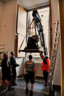 28 May 2024, Berlin: Workers watch an object being removed from the Pergamon Museum with the help of a crane. Berlin