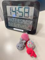 28 May 2024, Hesse, Frankfurt/Main: A large clock and crocheted snails are intended to provide orientation and support for people with dementia in a hospital. Photo: Sandra Trauner/dpa