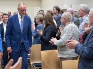 28 May 2024, Hesse, Hanau: Federal CDU chairman Friedrich Merz (l) comes to the Kulturhalle in Hanau-Steinheim as part of the European election campaign. Photo: Boris Roessler/dpa