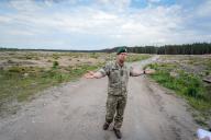 28 May 2024, Lithuania, Rudninkai: Lithuanian soldier Rimantas Jarmalavicius shows the cleared area near Rudninkai in the area where the German brigade is to be stationed in Lithuania. The size of the construction area for the German barracks is around 40 hectares. The total area is around 170 square kilometers with a huge shooting range. Photo: Kay Nietfeld/dpa