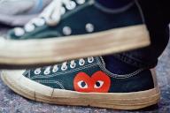 PRODUCTION - 07 May 2024, North Rhine-Westphalia, Bochum: A heart with eyes can be seen on the shoe of Milad Tabesch, son of refugee parents, on Europe Day at Louis Baare Berufskolleg. He founded the "Ruhrpott für Europa" project to inspire young people with and without a migration background for democracy and political participation with school workshops and discussion formats. Ahead of the European elections, in which 16-year-olds will be allowed to vote for the first time, he finds it particularly important to tell his own story. Photo: Bernd Thissen/dpa