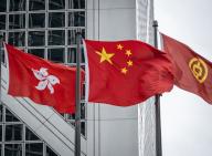 01 March 2024, China, Hongkong: The flag of Hong Kong (l, Hong Kong Special Administrative Region of the People
