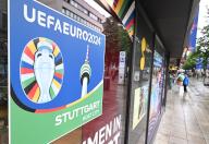 PRODUCTION - 31 May 2024, Baden-Württemberg, Stuttgart: A logo of the Stuttgart venue for the European Football Championship 2024 is stuck to a shop window in the city center. Five matches will be played in Stuttgart at the 2024 European Championships. Photo: Bernd Weißbrod/dpa