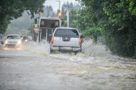 01 June 2024, Bavaria, Babenhausen: Cars drive through water on a flooded road. Photo: Jason Tschepljakow\/dpa