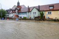 01 June 2024, Baden-Württemberg, Ochsenhausen: The B312 in Ochsenhausen is completely flooded by the river Rottum, which has burst its banks. Parts of the town center are under water. Photo: Thomas Warnack/dpa