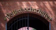 31 May 2024, Berlin: The words "Volkshochschule" are displayed at the entrance to the Volkshochschule City West. Photo: Monika Skolimowska/dpa
