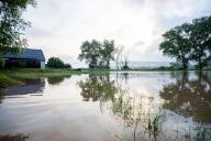 02 June 2024, Bavaria, Hemmendorf: A paddock near Hemmendorf (Haßberge district, Lower Franconia) is flooded. The Schenkenau gauge has reached reporting level 3. Roads are flooded, the flooded area reaches up to the first houses. Photo: Pia Bayer/dpa