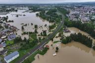 02 June 2024, Baden-Württemberg, Meckenbeuren: The high water of the Schussen river floods parts of Meckenbeuren. A railroad line has not yet been flooded, but water is already standing to the right and left of the tracks. (Aerial view with drone)- Photo: Felix Kästle/dpa