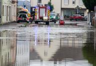 02 June 2024, Bavaria, Wertingen: Emergency vehicles stand on a flooded street in the city center. After the heavy rainfall of the last few days, there was severe flooding in the region. Photo: Stefan Puchner/dpa