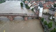 02 June 2024, Baden-Württemberg, Heidelberg: The B37 is flooded in the area of the Old Bridge in the old town. After heavy rainfall, there is high water with flooding in the region. Photo: Rene Priebe/dpa
