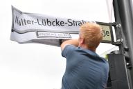 02 June 2024, Berlin: Members of the International Auschwitz Committee have symbolically renamed Joachim-Friedrich-Straße on Kurfürstendamm as Walter-Lübcke-Straße. Lübke was the district president of Kassel and was murdered on June 1, 2019 on the veranda in front of his home with a shot to the head from close range. A right-wing extremist confessed to the crime after his arrest and cited Lübcke
