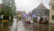 02 June 2024, Bavaria, Wertingen: Firefighters and water rescuers enter a flooded street with an inflatable boat. Bavaria and Baden-Württemberg are particularly badly affected by the floods. Photo: Stefan Puchner/dpa