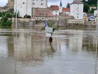 02 June 2024, Bavaria, Passau: A sign stands in the floodwater. The three-river city of Passau in Lower Bavaria is also struggling with considerable flooding due to the heavy rain. The level of the Danube rose to more than 7.70 meters on Sunday, according to the flood information service. Numerous streets and squares in the city are under water. Photo: Markus Zechbauer/Zema Medien/dpa