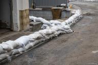 02 June 2024, Thuringia, Zillbach: Sandbags lie on the road to protect the houses from further flooding. The village of Zillbach, municipality of Schwallungen, clears up the damage caused by the heavy rain with the help of the fire department. Photo: Daniel Vogl/dpa