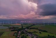 02 June 2024, Brandenburg, Sieversdorf: A thunderstorm cell moves across the landscape in the Oder-Spree district in East Brandenburg in the late evening (aerial view with a drone). Photo: Patrick Pleul/dpa
