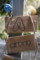 PRODUCTION - 25 May 2024, Turkey, Dalyan: On a wooden sign is a reference to an Airbnb accommodation. Photo: Jens Kalaene/dpa