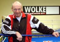 FILED - 07 January 2003, Brandenburg, Frankfurtoder: Boxing trainer Manfred Wolke stands in the boxing ring of the Wolke Camp in Frankfurt (Oder) on January 7, 2003 and looks smilingly into the photographer