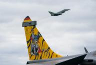 03 June 2024, Schleswig-Holstein, Jagel: A Tiger can be seen on the vertical stabilizer of a fighter jet during the NATO air force manoeuvre "Tiger Meet" on the airfield of the Tactical Air Force Wing 51 "Immelmann". Around 60 fighter jets and helicopters from eleven NATO states as well as Switzerland and Austria are taking part in the international air force maneuver "Tiger Meet" in Jagel, Schleswig-Holstein. Photo: Marcus Brandt/dpa