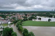 03 June 2024, Bavaria, Offingen: Meadows and farmland are flooded by the high water of the Mindel (aerial photo taken with a drone). For days, helpers in Bavaria and Baden-Württemberg have been battling the flood and its consequences. The flood situation remains dynamic and confusing. Many small communities are affected, and in some places the situation is even getting worse. Photo: Karl-Josef Hildenbrand/dpa