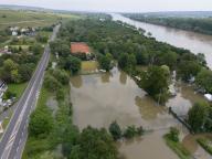 03 June 2024, Hesse, Hattenheim: The high water of the Rhine has flooded the sports field in Hattenheim (aerial view with a drone). The level of the Rhine is initially expected to rise further. Photo: Boris Roessler/dpa