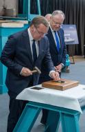 03 June 2024, Mecklenburg-Western Pomerania, Wolgast: Boris Pistorius (SPD, l), Federal Minister of Defense Boris Pistorius holds a hammer at the keel-laying ceremony for the F126 "Niedersachsen" frigate at the Peene shipyard. Standing next to him is Stephan Weil (SPD), Minister President of Lower Saxony. In keeping with tradition, a euro coin is placed under the keel during the ceremony. Photo: Stefan Sauer/dpa