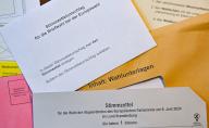 03 June 2024, Brandenburg, Briesen: Postal voting documents for the European elections are on a table. On June 9, 2024, millions of people in Germany will be able to have their say on how the European Union should develop. The European Union, or EU for short, is a union of 27 countries. The EU Parliament is being elected in these countries this week. In Germany, anyone aged 16 or over can cast a cross and vote for a party. Photo: Patrick Pleul/dpa