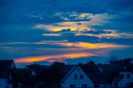 27 October 2022, Mecklenburg-Western Pomerania, Vitte: Sunset over the fishing village Vitte on the island Hiddensee. Photo: Stefan Sauer/dpa