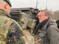 20 February 2023, Munster: German Defense Minister Boris Pistorius talks with an instructor of the Marder armored infantry fighting and troop carrier during his visit to the Bundeswehr tank school in Munster, in the west of the country, where Ukrainian soldiers are trained to operate both the Marder and the Leopard 2 tank. Photo: Carsten Hoffmann/dpa