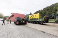 05 October 2023, Baden-Württemberg, Oppenau: A Leopard 2A6M main battle tank stands in front of the Doll company building while the associated heavy-duty trailer can be seen next to it. Over the next five years, the Doll Fahrzeugbau company will be equipping the Bundeswehr with 250 new semitrailers for transporting main battle tanks. Photo: Philipp von Ditfurth/dpa