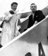 Katharine Hepburn and Robert Helpmann, boarding a Quantas flight to Sidney Australia where Hepburn will appear in three stage plays for the Old Vic Company. San Fransisco, California, March 3, 1957. Courtesy CSU Archives/Everett Collection.