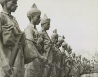 Newly arrived British Indian soldiers stand at attention prior to inspection at Singapore. Ca. Dec. 1941. World War 2. (BSLOC_2014_10_145)
