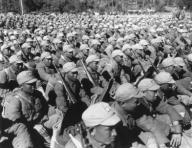 Chinese soldiers seated in rows equipped with rifles and fresh uniforms in 1945. World War 2 (BSLOC_2014_10_133)