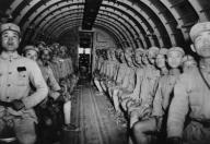 Chinese soldiers enroute to India in a U.S. DC-3 transport airplane. Ca. 1943. World War 2. (BSLOC_2014_10_132)