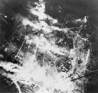 Aerial view of Tokyo burning following incendiary bombing by B-29s, on the night of May 26, 1945. World War 2. (BSLOC_2014_10_122)