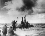 British artillery shelling an enemy position in Libya during World War 2. Ca. 1941-42. (BSLOC_2014_10_1)
