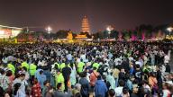 Tourists pack into the square in front of the ancient Great Wild Goose Pagoda despite the authority canceled routine performances to discourage tourists in Xi\'an city in northwest China\'s Shaanxi province Wednesday, May 01, 2024