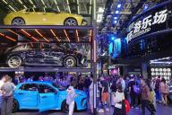 People tour in the booth of LYNK &amp; CO, a Chinese automaker, during the Beijing Auto Show in Beijing, China Friday, May 03, 2024