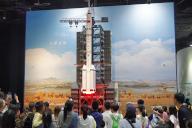 Students watch a demonstration of the lift off of a Long March-2F at China\'s Science and Technology Museum in Beijing, China Saturday, May 04, 2024