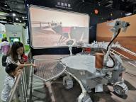 A mother talks to her child about the model of Zhurong Mars Rover at China\'s Science and Technology Museum in Beijing, China Saturday, May 04, 2024