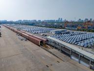 An aerial view of new cars to be exported at a railway freight yard in Zhengzhou city in central China\'s Henan province Monday, May 06, 2024
