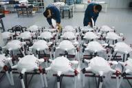 Workers assemble drones in a factory in Yuexi county in central China
