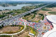 Traffic jam up as people come to see Guo Zhuang, stage-named Guo Youcai, performing in a park in Heze, in east China