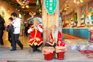 Two aged Uygur men play music for tourists to the Grand Bazaar in Urumqi in northwest China