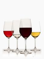 Glasses of red, white and rose wine on white background