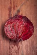 Sliced red beet on wood background