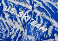 Snowflakes on a jacket of the US Ski Team during the FIS cross country World Cup in Davos, on December 10th, 2017. Photo: Gunter Schiffmann/GASPA