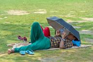 NEW DELHI, INDIA - MAY 5: Visitors out on a hot sunny day at India Gate, in New Delhi, on May 5, 2024 in New Delhi, India. As temperature is rise in Delhi NCR. (Photo by Sanjeev Verma\/Hindustan Times